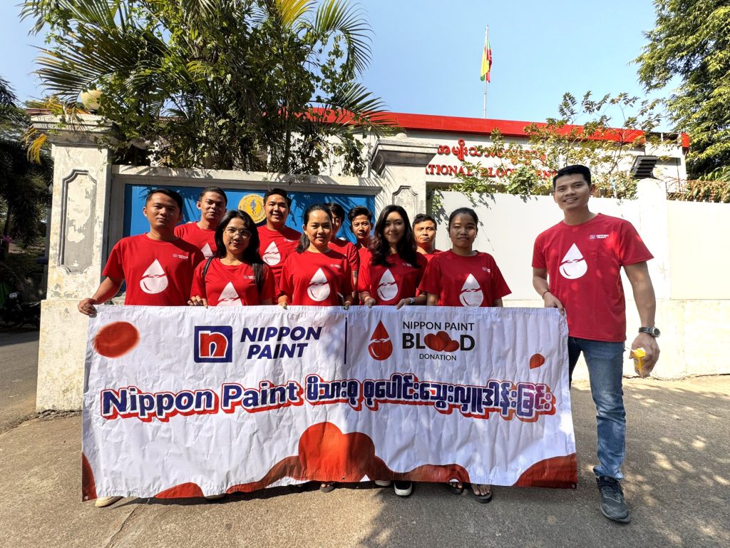 Nippon Paint Myanmar employees participating in a collective blood donation drive.