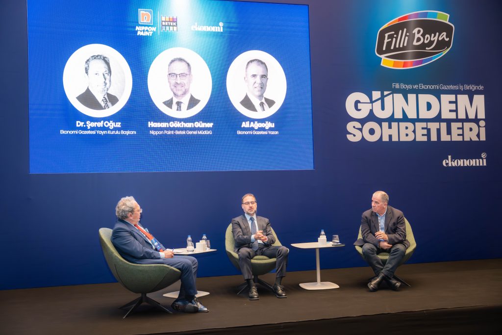 Three panellists engaged in a business discussion on stage during the Betek Agenda Conversations event in Antalya.