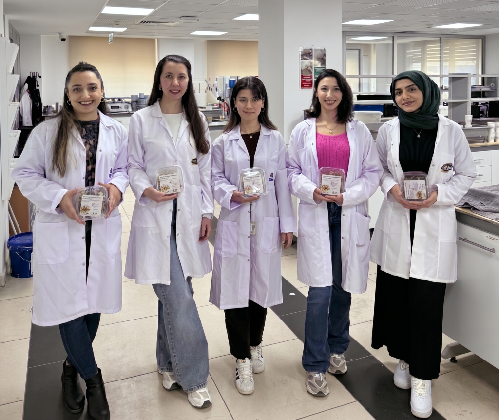 Female colleagues from Betek smiling and posing together during an International Women's Day gathering.