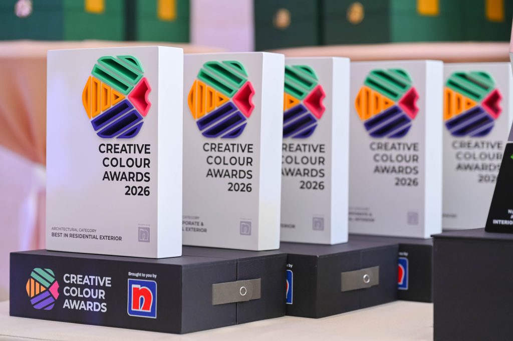 A neat row of Creative Colour Awards 2026 trophies displayed on a table.
